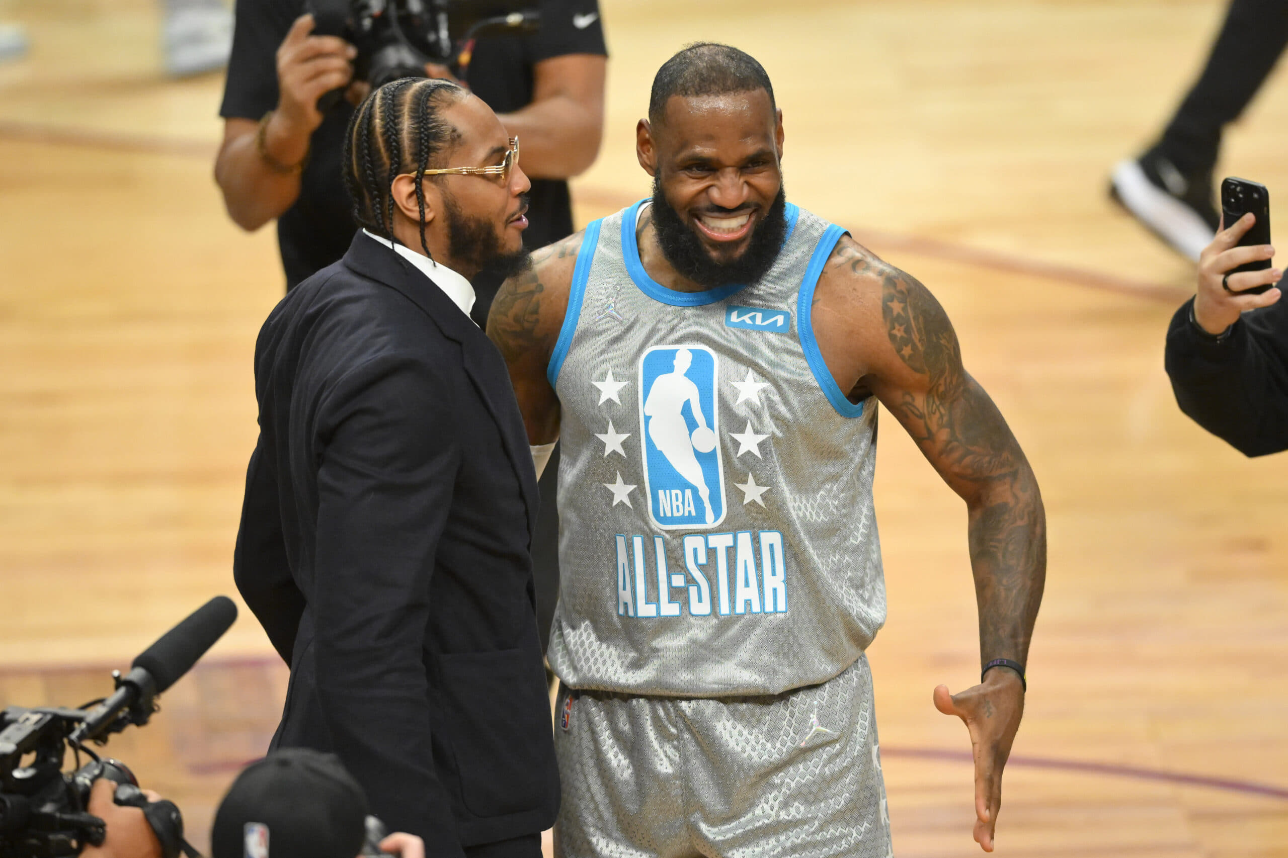 Feb 19, 2023; Salt Lake City, UT, USA; Carmelo Anthony, Dwyane Wade and LeBron James greet each other before the 2023 NBA All-Star Game at Vivint Arena