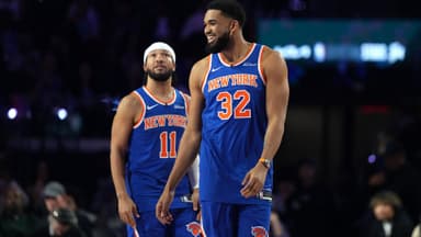 Feb 14, 2026; Los Angeles, CA, USA; Team Knicks guard Jalen Brunson (11) of the New York Knicks and center Karl-Anthony Towns (32) of the New York Knicks react during the shooting stars competition during the 2026 NBA All Star Saturday Night at Intuit Dome