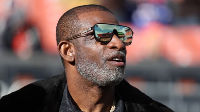 Legendary football and baseball player and father of Cleveland Browns quarterback Shedeur Sanders, Deion Sanders on the sidelines prior to a game against the Buffalo Bills at Huntington Bank Field.