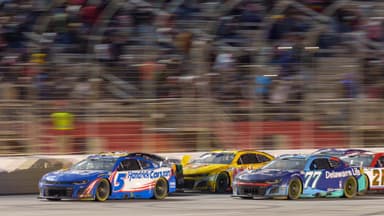 Feb 23, 2025; Hampton, Georgia, USA; Kyle Larson (5) fights for position during the final laps at Atlanta Motor Speedway.