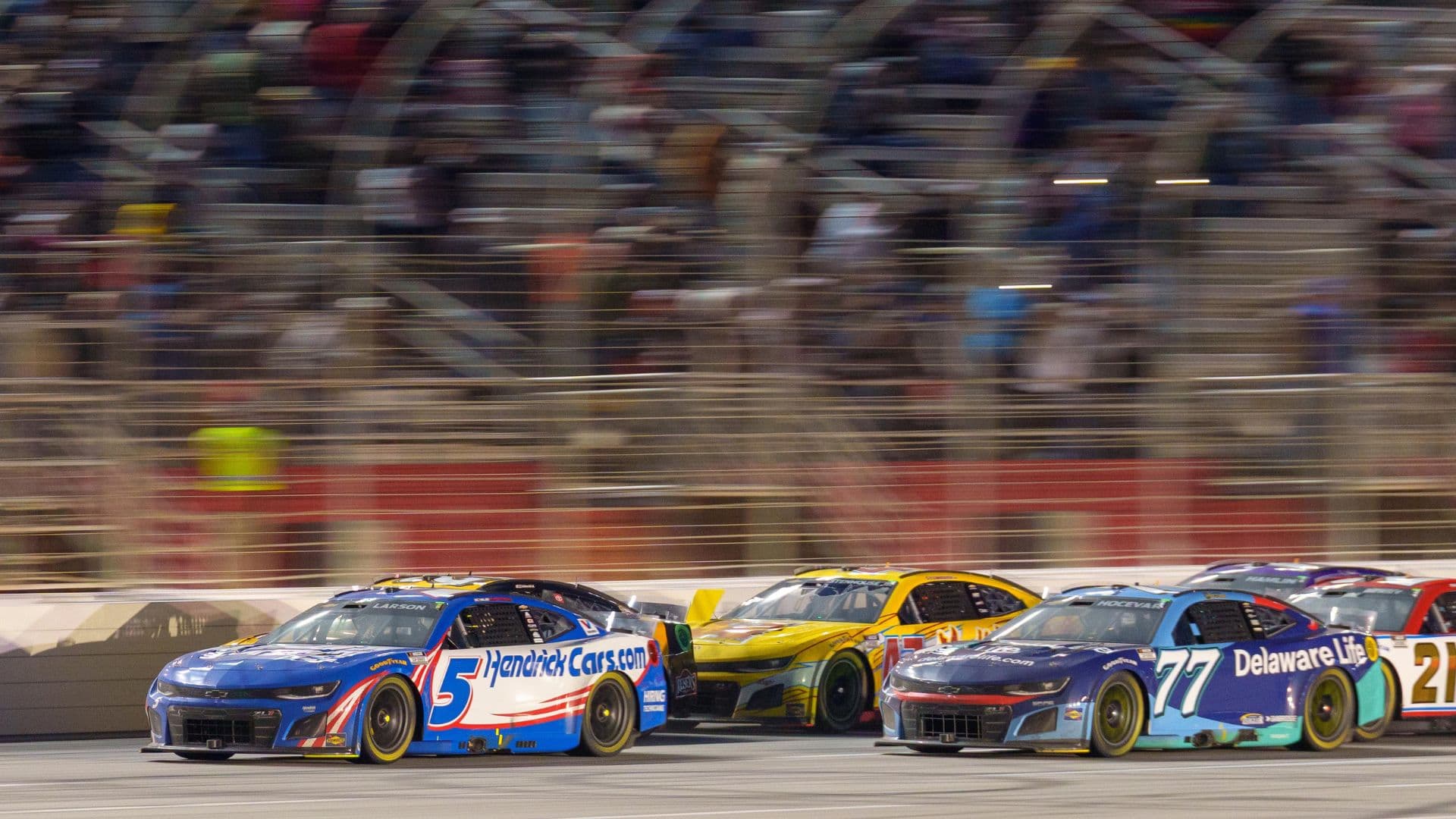 Feb 23, 2025; Hampton, Georgia, USA; Kyle Larson (5) fights for position during the final laps at Atlanta Motor Speedway.