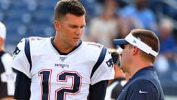 New England Patriots quarterback Tom Brady (12) talks with New England Patriots offense coordinator Josh McDaniels before the game against the Tennessee Titans at Nissan Stadium. Mandatory