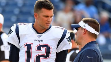 New England Patriots quarterback Tom Brady (12) talks with New England Patriots offense coordinator Josh McDaniels before the game against the Tennessee Titans at Nissan Stadium. Mandatory