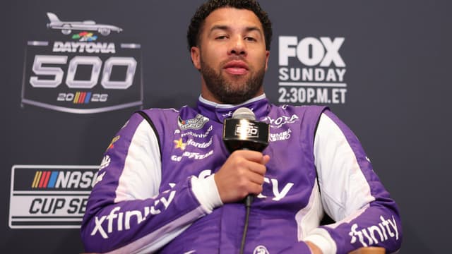 Feb 11, 2026; Daytona Beach, Florida, USA; NASCAR Cup Series driver Bubba Wallace (23) speaks to the media during the Daytona 500 Media Day at Daytona International Speedway