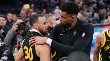 Milwaukee Bucks forward Giannis Antetokounmpo (34) and Golden State Warriors guard Stephen Curry (30) meet after the game at the Chase Center.