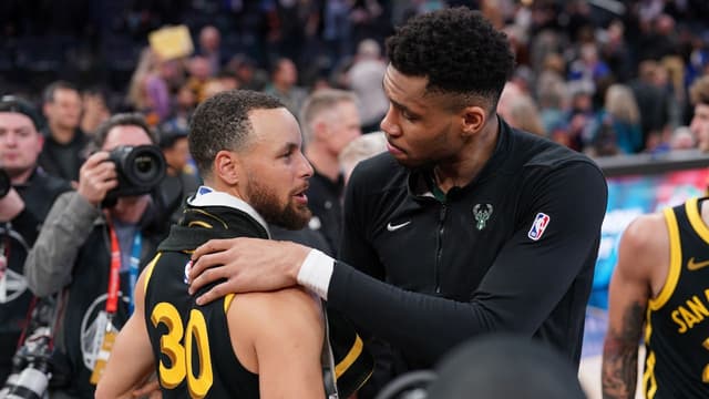 Milwaukee Bucks forward Giannis Antetokounmpo (34) and Golden State Warriors guard Stephen Curry (30) meet after the game at the Chase Center.