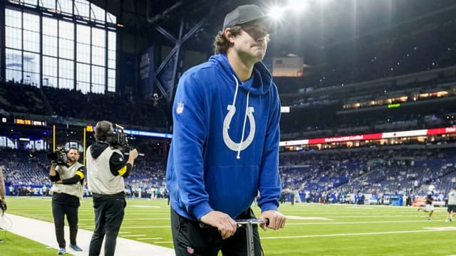 Indianapolis Colts quarterback Daniel Jones moves along the sideline on a scooter Sunday, Dec. 28, 2025, ahead a game against the Jacksonville Jaguars at Lucas Oil Stadium in Indianapolis.