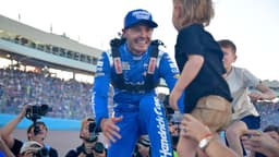 Nov 2, 2025; Avondale, Arizona, USA; NASCAR Cup Series driver Kyle Larson (5) celebrates his championship victory with son Cooper following the Cup Series Championship race at Phoenix Raceway.