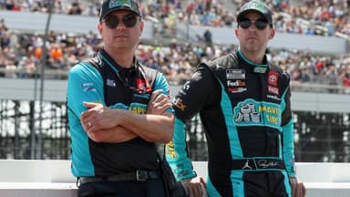 Jul 14, 2024; Long Pond, Pennsylvania, USA; NASCAR Cup Series driver Denny Hamlin (right) stands with his crew chief Chris Gabehart (left) on pit road prior to The Great American Getaway 400 at Pocono Raceway