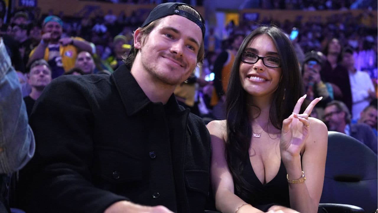Los Angeles Chargers quarterback Justin Herbert (left) and girlfriend Madison Beer attend the game between the Minnesota Timberwolves and the Los Angeles Lakers at Crypto.com Arena.