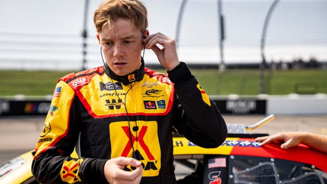 Connor Zilisch (88) puts in earpieces during NASCAR Xfinity Series qualifying on Aug. 2, 2025, at Iowa Speedway in Newton, Iowa.