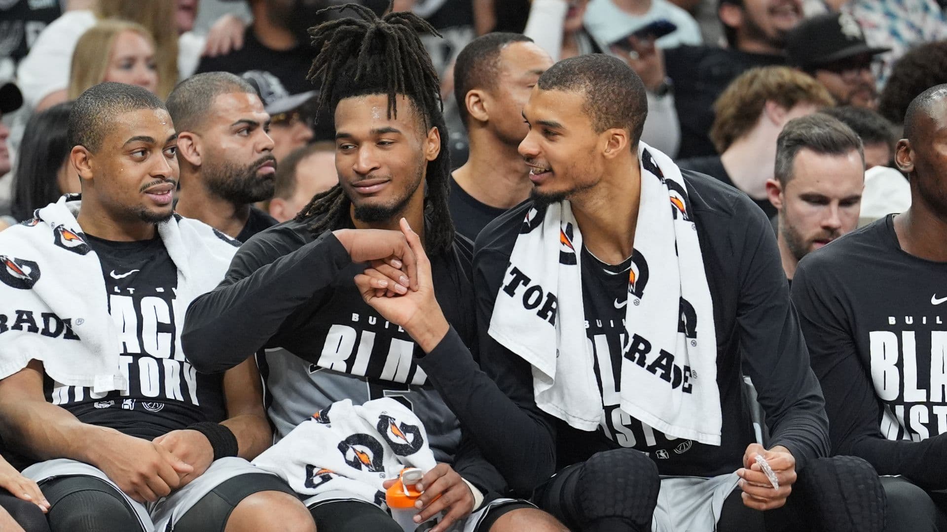 Feb 7, 2026; San Antonio, Texas, USA; San Antonio Spurs forward Victor Wembanyama (1) shakes the hand of guard Stephon Castle (5) during the second half against Dallas Mavericks at Frost Bank Center.
