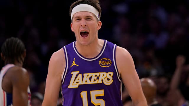 Feb 5, 2026; Los Angeles, California, USA; Los Angeles Lakers guard Austin Reaves (15) reacts at the buzzer defeating the Philadelphia 76ers at Crypto.com Arena.