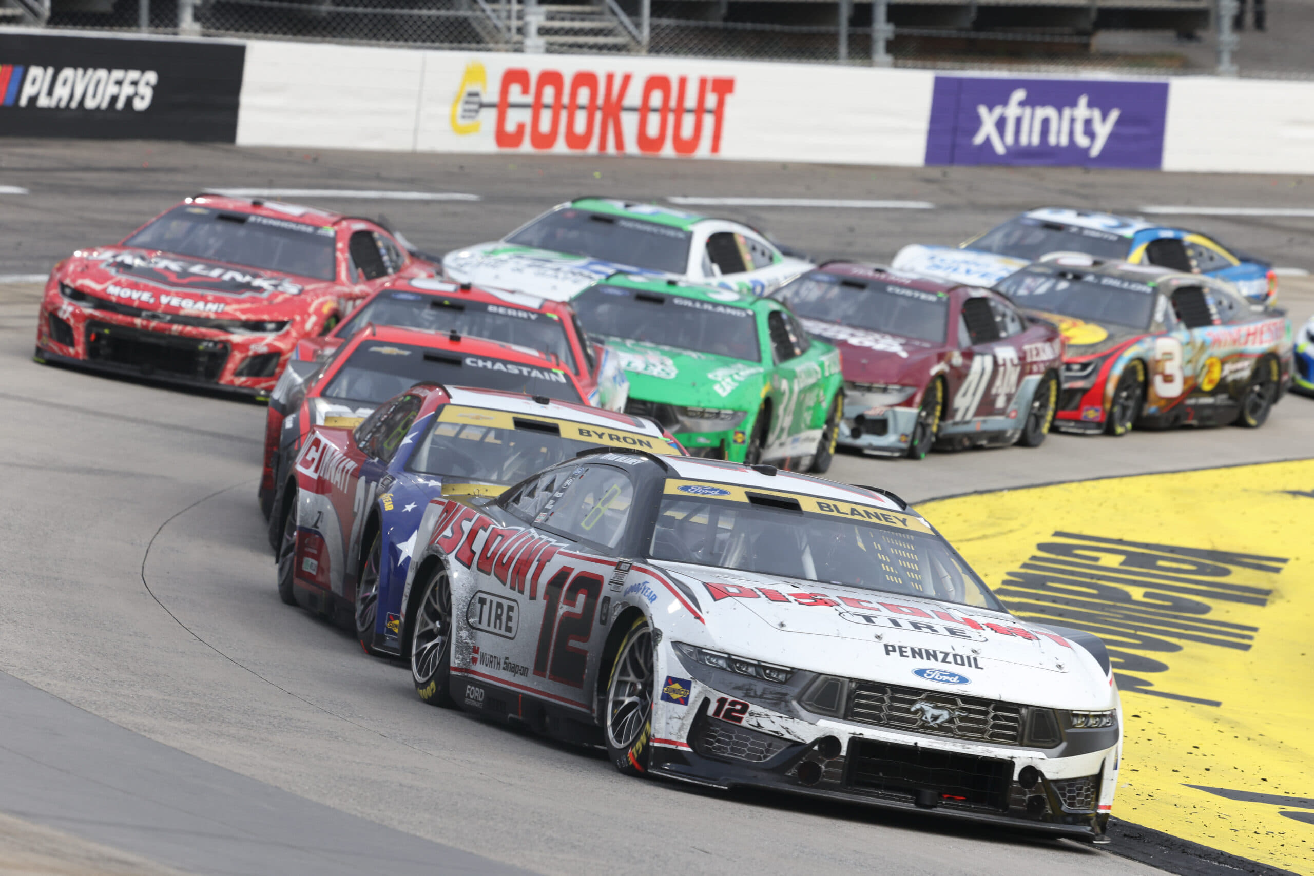 Oct 26, 2025; Martinsville, Virginia, USA; NASCAR Cup Series driver Ryan Blaney (12) leads during stage three of the Xfinity 500 at Martinsville Speedway. Mandatory Credit: Greg Atkins-Imagn Images