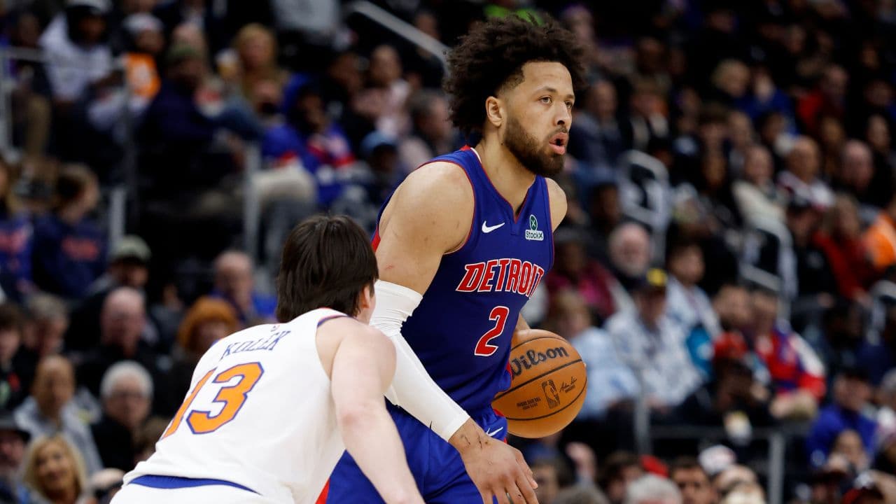 Jan 5, 2026; Detroit, Michigan, USA; Detroit Pistons guard Cade Cunningham (2) dribbles defended by New York Knicks guard Tyler Kolek (13) in the second half at Little Caesars Arena. Mandatory Credit: Rick Osentoski-Imagn Images