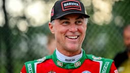 Former NASCAR Cup Series champion Kevin Harvick smiles during an autograph session before the 13th annual Masters of the Pros 200 race on Wednesday, July 16, 2025