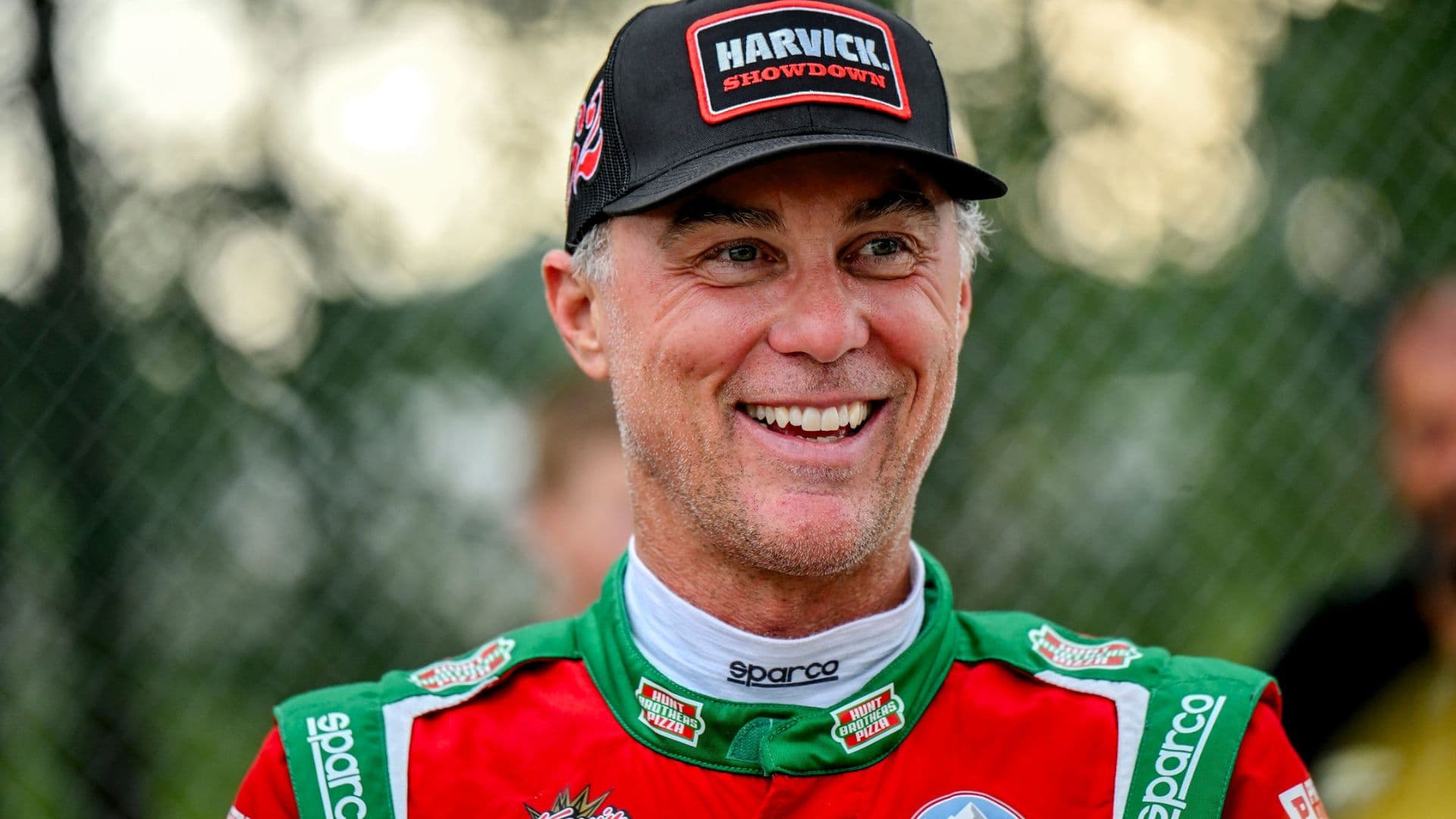 Former NASCAR Cup Series champion Kevin Harvick smiles during an autograph session before the 13th annual Masters of the Pros 200 race on Wednesday, July 16, 2025