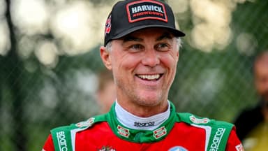 Former NASCAR Cup Series champion Kevin Harvick smiles during an autograph session before the 13th annual Masters of the Pros 200 race on Wednesday, July 16, 2025
