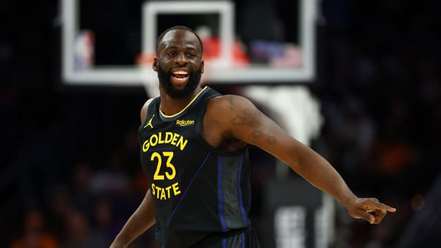 Feb 5, 2026; Phoenix, Arizona, USA; Golden State Warriors forward Draymond Green (23) reacts against the Phoenix Suns in the first half at Mortgage Matchup Center