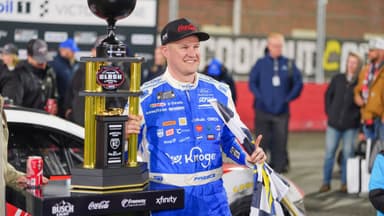 Feb 4, 2026; WInston-Salem, North Carolina, USA; NASCAR Cup Series driver Ryan Preece (60) holds the Bobby Allison Memorial Trophy after winning the Cook Out Clash at Bowman Gray Stadium.