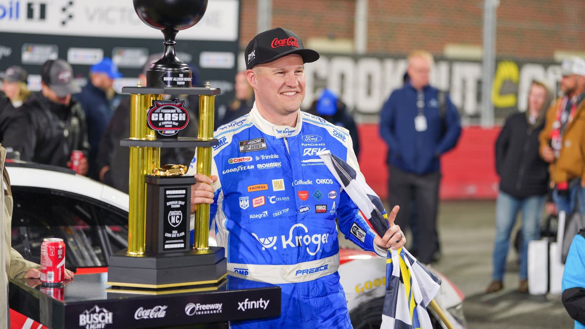 Feb 4, 2026; WInston-Salem, North Carolina, USA; NASCAR Cup Series driver Ryan Preece (60) holds the Bobby Allison Memorial Trophy after winning the Cook Out Clash at Bowman Gray Stadium.