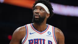 Feb 7, 2026; Phoenix, Arizona, USA; Philadelphia 76ers center Joel Embiid (21) reacts against the Phoenix Suns during the first half of an NBA game at Mortgage Matchup Center