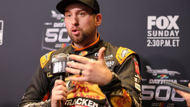 Feb 11, 2026; Daytona Beach, Florida, USA;NASCAR Cup Series driver Chase Briscoe (19) speaks to the media during the Daytona 500 Media Day at Daytona International Speedway.