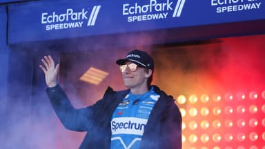 Feb 22, 2026; Hampton, Georgia, USA; NASCAR Cup Series driver Carson Hocevar waves during introductions at EchoPark Speedway.