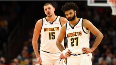 Denver Nuggets guard Jamal Murray (27) and center Nikola Jokic (15) against the Phoenix Suns at the Mortgage Matchup Center