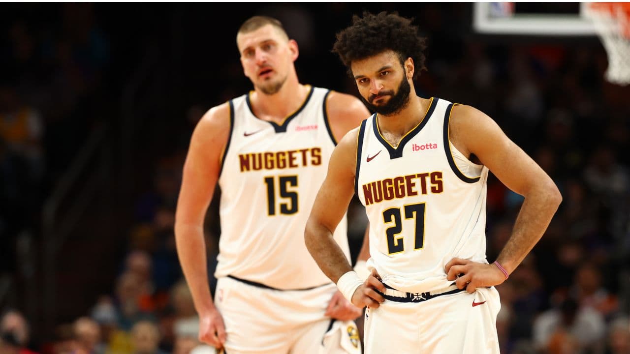 Denver Nuggets guard Jamal Murray (27) and center Nikola Jokic (15) against the Phoenix Suns at the Mortgage Matchup Center