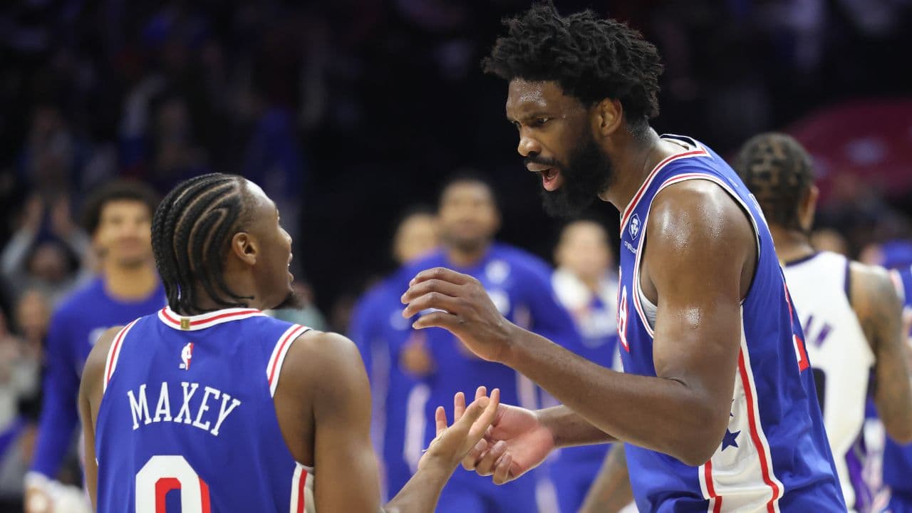 Philadelphia 76ers center Joel Embiid (21) reacts with Philadelphia 76ers guard Tyrese Maxey (L) after a victory against the Sacramento Kings at Xfinity Mobile Arena.