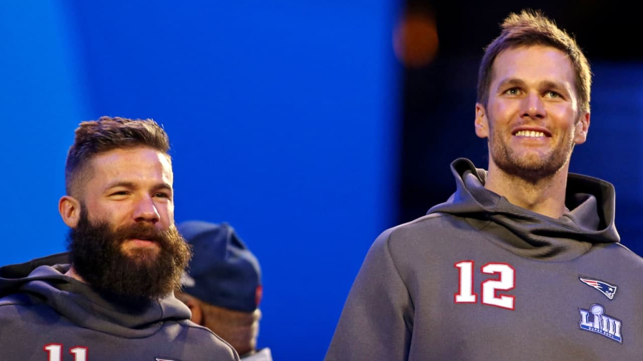 New England Patriots quarterback Tom Brady (12) and wide receiver Julian Edelman (11) during Opening Night for Super Bowl LIII at State Farm Arena.