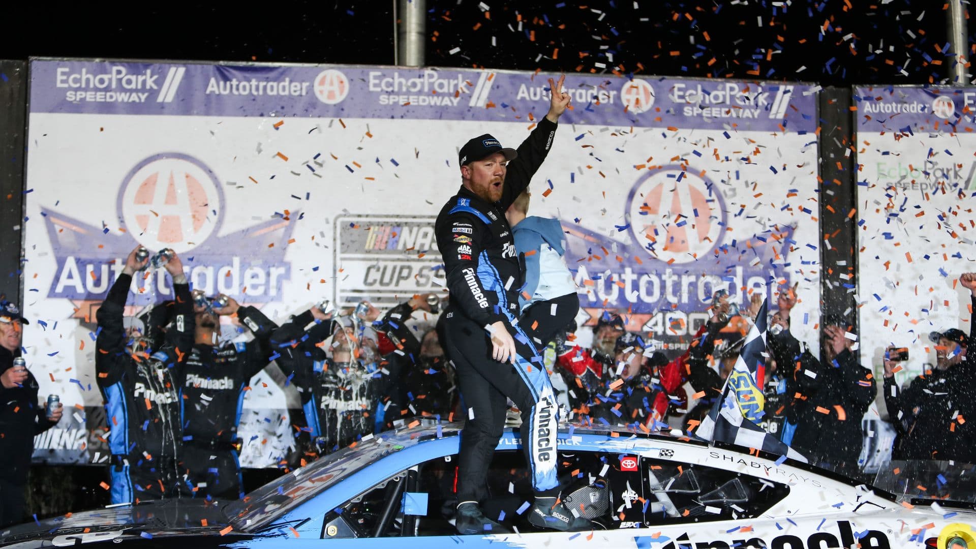 driver Tyler Reddick celebrates the win at EchoPark Speedway.