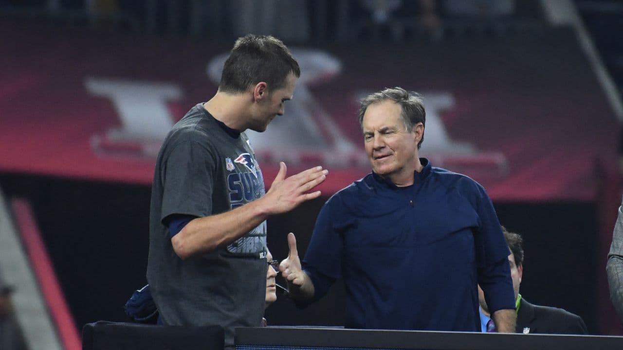 New England Patriots quarterback Tom Brady (12) and New England Patriots head coach Bill Belichick celebrate after Super Bowl LI at NRG Stadium.