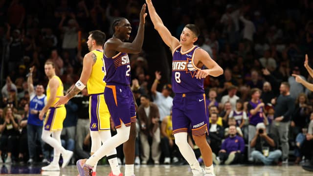 Feb 26, 2026; Phoenix, Arizona, USA; Phoenix Suns guard Grayson Allen (8) celebrates with forward Rasheer Fleming (20) against the Los Angeles Lakers in the second half at Mortgage Matchup Center.