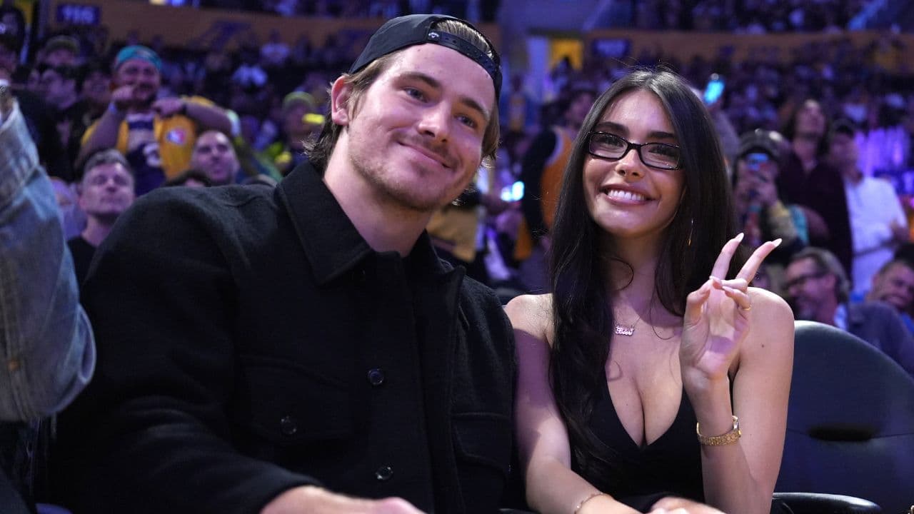 Los Angeles Chargers quarterback Justin Herbert (left) and girlfriend Madison Beer attend the game between the Minnesota Timberwolves and the Los Angeles Lakers at Crypto.com Arena.