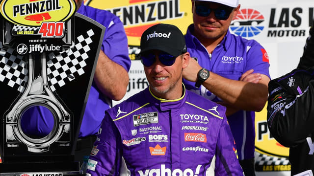 Mar 15, 2026; Las Vegas, Nevada, USA; Joe Gibbs Racing driver Denny Hamlin (11) celebrates his victory following the Pennzoil 400 at Las Vegas Motor Speedway. Mandatory Credit: Gary A. Vasquez-Imagn Images