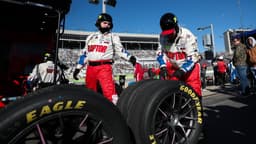 Feb 22, 2026; Hampton, Georgia, USA; Raptor team members work on the tires at EchoPark Speedway.