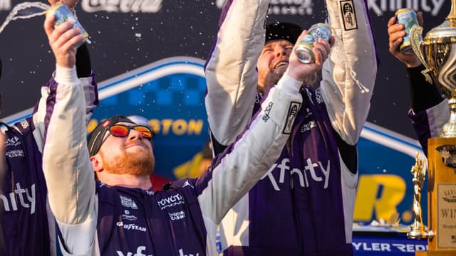 Mar 22, 2026; Darlington, South Carolina, USA; 23XI Racing Tyler Reddick (45) celebrates in Victory Lane after winning at Darlington Raceway.