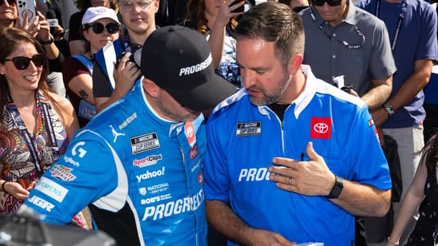 Nov 2, 2025; Avondale, Arizona, USA; NASCAR Cup Series driver Denny Hamlin (11) with crew chief Chris Gayle during the NASCAR Championship race at Phoenix Raceway.