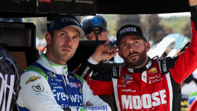 Aug 19, 2023; Watkins Glen, New York, USA; NASCAR Cup Series driver Daniel Suarez (left) and driver Ross Chastain (right) look on during practice and qualifying for the Go Bowling at The Glen at Watkins Glen International. Mandatory Credit: Matthew O'Haren-Imagn Images
