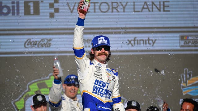 Mar 8, 2026; Avondale, Arizona, USA; Team Penske driver Ryan Blaney (12) celebrates his victory of the Straight Talk Wireless 500 at Phoenix Raceway