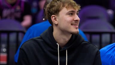 Feb 20, 2026; Minneapolis, Minnesota, USA; Dallas Mavericks forward Cooper Flagg (32) watches the second quarter against the Minnesota Timberwolves at Target Center