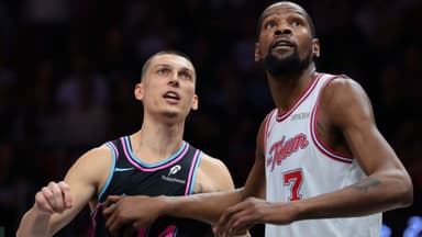 Houston Rockets forward Kevin Durant (7) defends against Miami Heat guard Tyler Herro (14) during the fourth quarter at Kaseya Center.