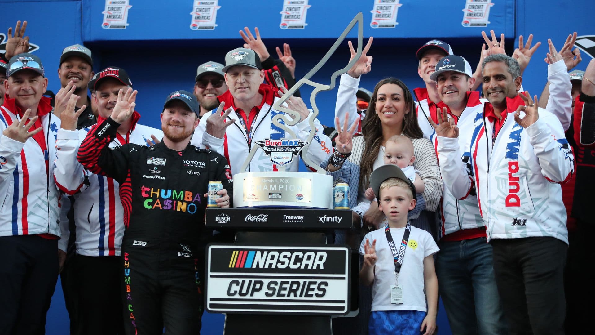 Mar 1, 2026; Austin, Texas, USA; NASCAR Cup Series driver Tyler Reddick (45) and his family celebrate winning the NASCAR Cup Series Duramax Texas Grand Prix Powered by RelaDyne at Circuit of the Americas.