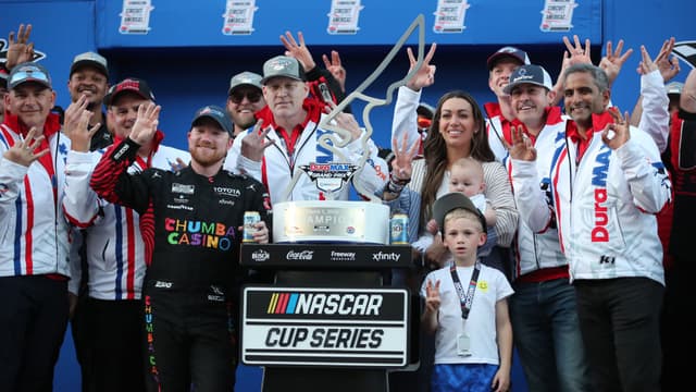 Mar 1, 2026; Austin, Texas, USA; NASCAR Cup Series driver Tyler Reddick (45) and his family celebrate winning the NASCAR Cup Series Duramax Texas Grand Prix Powered by RelaDyne at Circuit of the Americas.