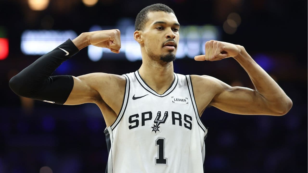 San Antonio Spurs forward Victor Wembanyama (1) reacts after his team scores against the Philadelphia 76ers during the second quarter at Xfinity Mobile Arena