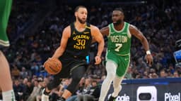 Golden State Warriors guard Stephen Curry (30) dribbles past Boston Celtics forward Jaylen Brown (7) in the third quarter at the Chase Center.