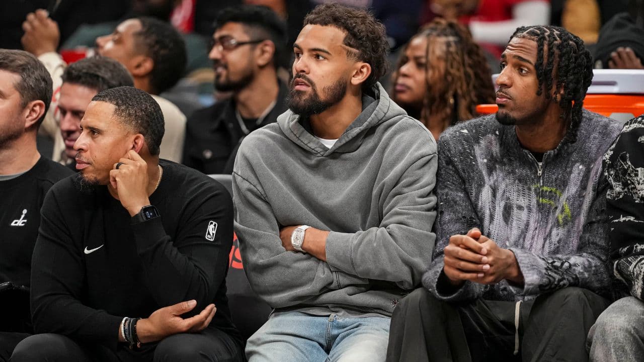 Washington Wizards guard Trae Young (3) watches from the bench during the game against the Atlanta Hawks during the second half at State Farm Arena