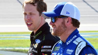 May 6, 2017; Talladega, AL, USA; NASCAR Cup Series driver Brad Keselowski (2) talks with Dale Earnhardt Jr. (88) during qualifying for the GEICO 500 at Talladega Superspeedway